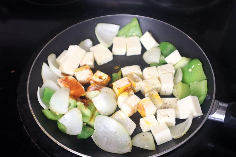 Step 3.8: Add paneer cubes, salt, red chili powder, and black pepper