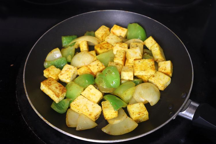Step 3.9: Add paneer cubes, salt, red chili powder, and black pepper