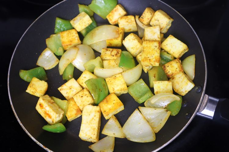 Step 3.10: Add paneer cubes, salt, red chili powder, and black pepper