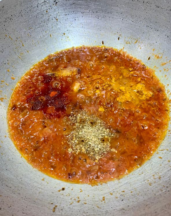 Step 1.1: Add the coriander powder, turmeric, red chilli powder and salt to the wok