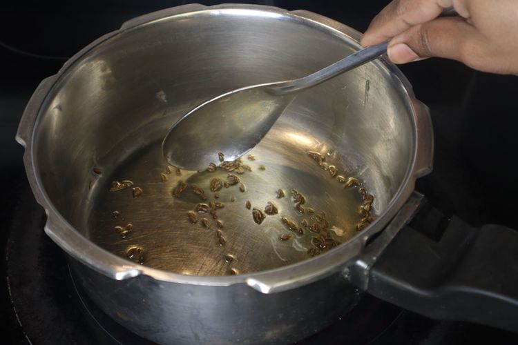 Step 3.2: Add 2 tsp of cumin seeds to the hot ghee
