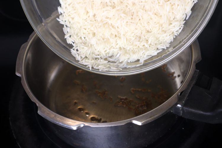 Step 4.1: Add the soaked and drained basmati rice to the pressure cooker