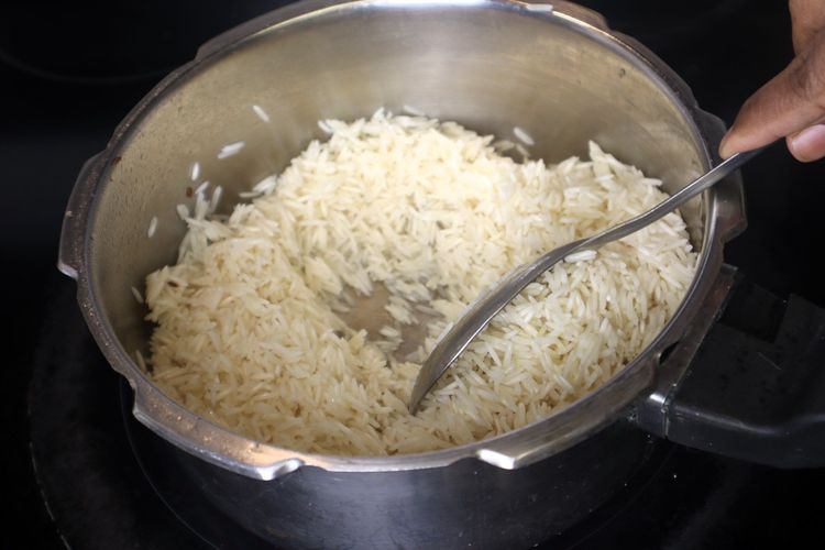 Step 4.3: Add the soaked and drained basmati rice to the pressure cooker