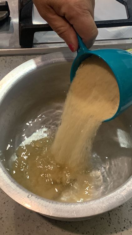 Step 1.1: Mix sugar, water, and green cardamoms in a deep pan