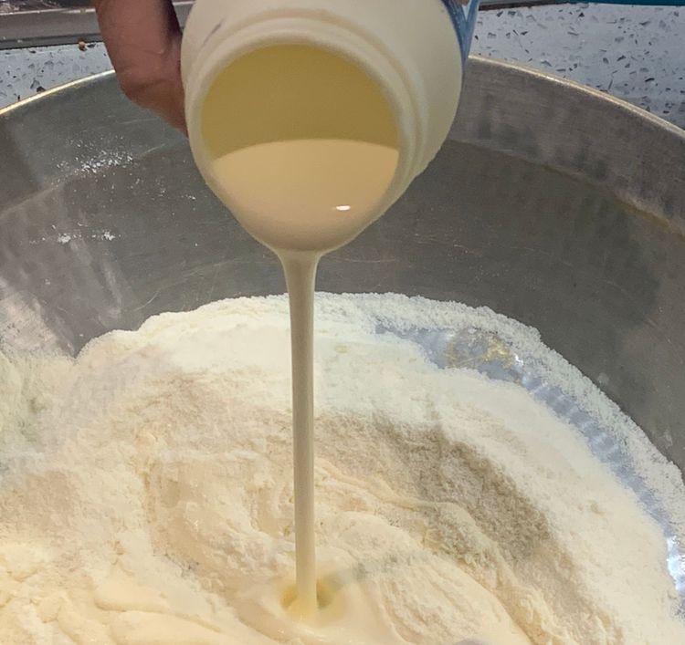 Step 2.1: Add cream to the flour mixture gradually