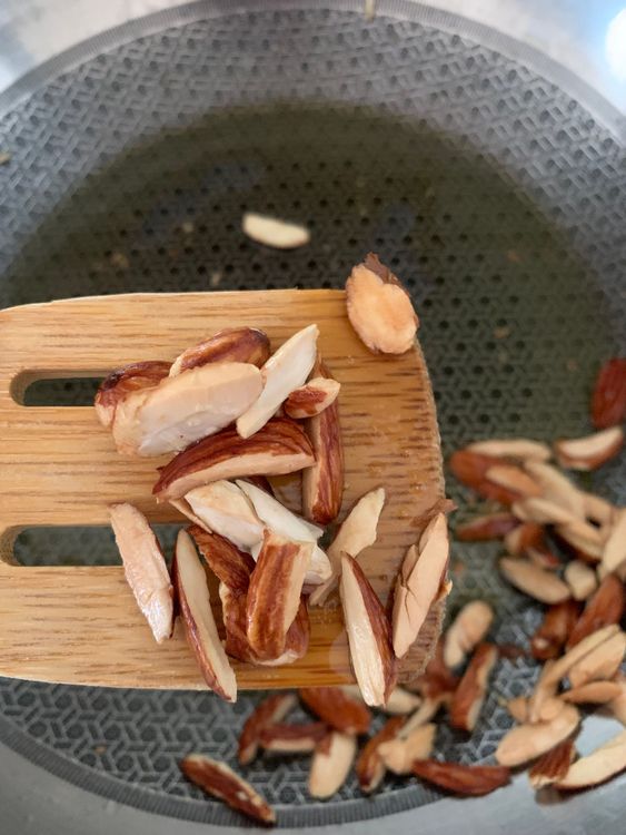 Step 3.1: Add the sliced almonds and roast them slightly until they lose their raw taste