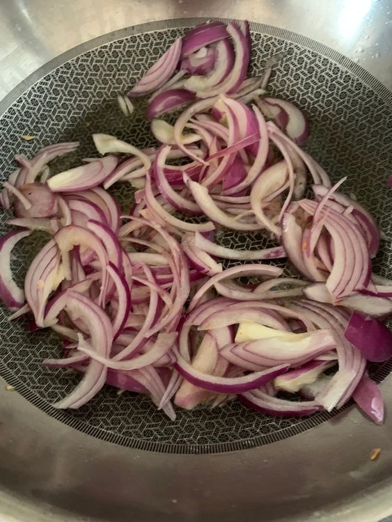 Step 4.1: Add the sliced onions and cook until they become soft and slightly golden