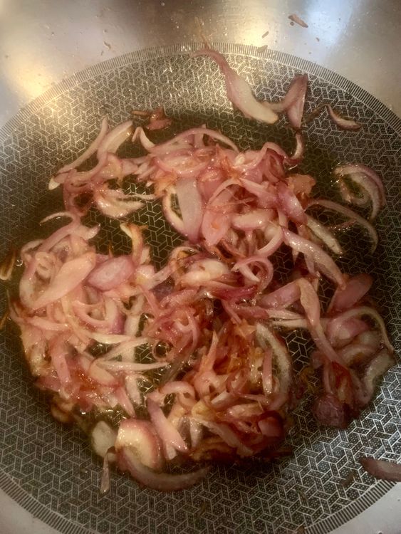 Step 4.2: Add the sliced onions and cook until they become soft and slightly golden