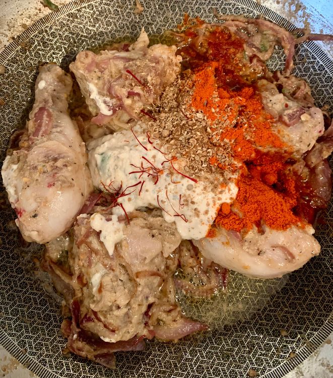 Step 4.1: Add the leftover marinade, Kashmiri red chilli powder, coriander powder, and saffron strands