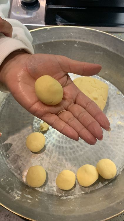 Step 2.2: Take small portions of the dough and shape them into small lemon-sized balls, ensuring there are no cracks