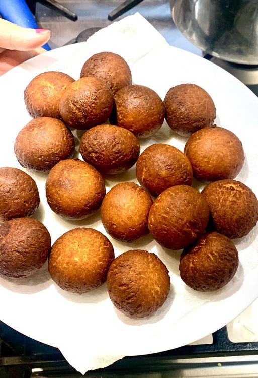 Step 2.2: Use a slotted spoon to remove the fried balls from the oil and place them on a kitchen towel to absorb excess oil