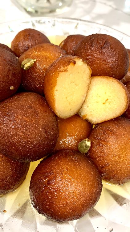 Step 2.1: Sprinkle desiccated coconut over the Gulab jamuns for garnishing