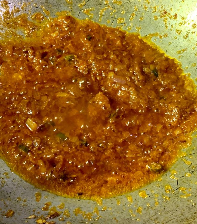 Step 2.1: Add tomato puree, coriander powder, turmeric, salt, dry mango powder (amchur), and red chilli powder, mix and cook for a few seconds