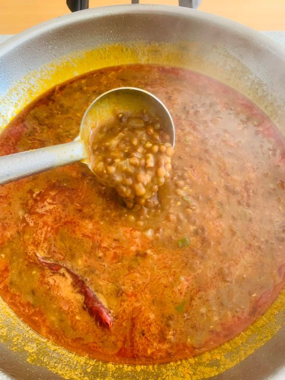 Step 4.1: Add the boiled dal to the pan with the tempering