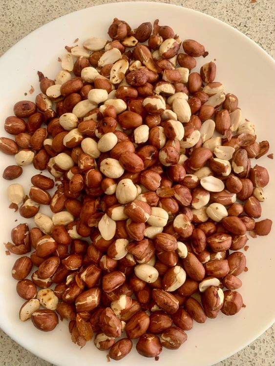 Step 1.1: Dry roast the peanuts in a pan over medium heat until they are fragrant and lightly browned