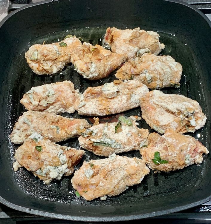 Step 1.1: Place the coated chicken wings on the heated grill pan
