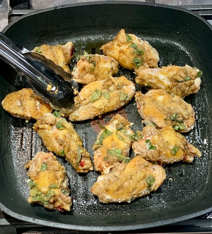 Step 1.2: Place the coated chicken wings on the heated grill pan