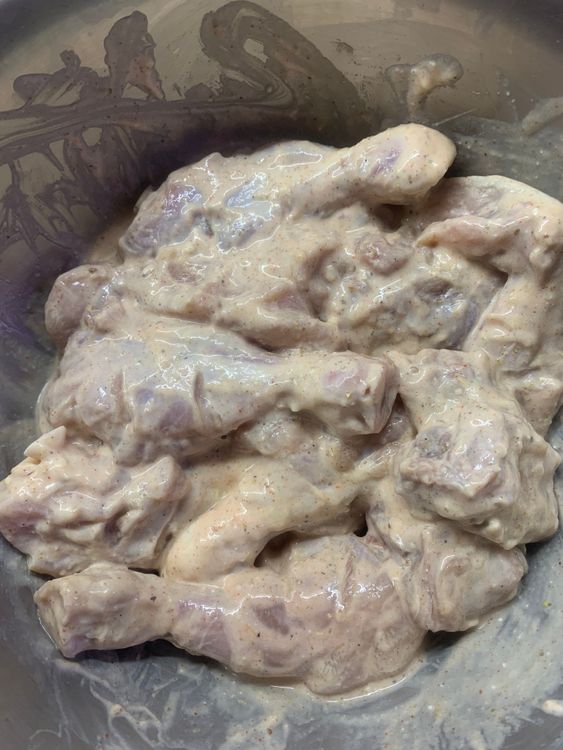 Step 2.2: Coat the vinegar-coated chicken drumsticks with a 3 tbsp yogurt mixture, ensuring each drumstick is well coated