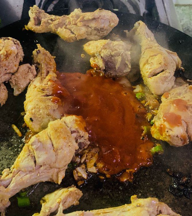 Step 2.1: Place drumsticks on tawa and mix with tomato-onion mixture