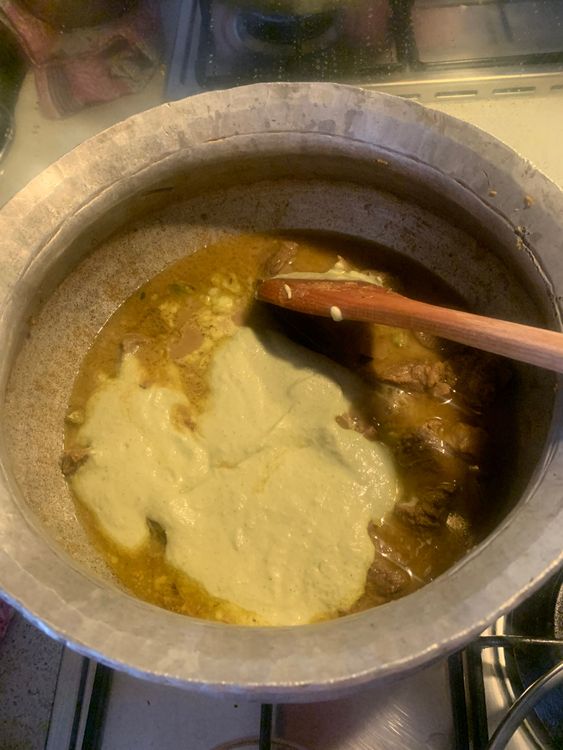 Step 3.1: Once the mutton is cooked, add the prepared paste, the remaining green chillies, and one-fourth cup of water to the wok
