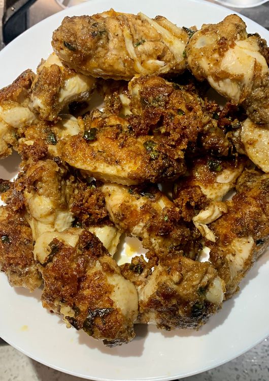 Step 1.1: Transfer the cooked chicken wings to a plate and set them aside