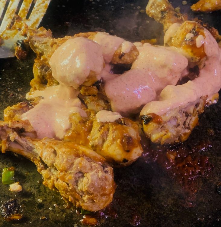 Step 2.1: Now, add the remaining yogurt mixture while tossing until the drumsticks are golden brown and fully cooked