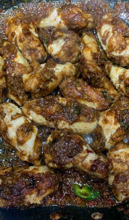 Step 1.2: Add the chicken wings to the sauce and gently toss to coat them evenly
