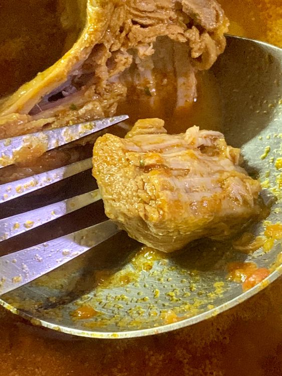 Step 1.1: To check if the goat is tender, it should come apart from the bone when poked with a fork or knife