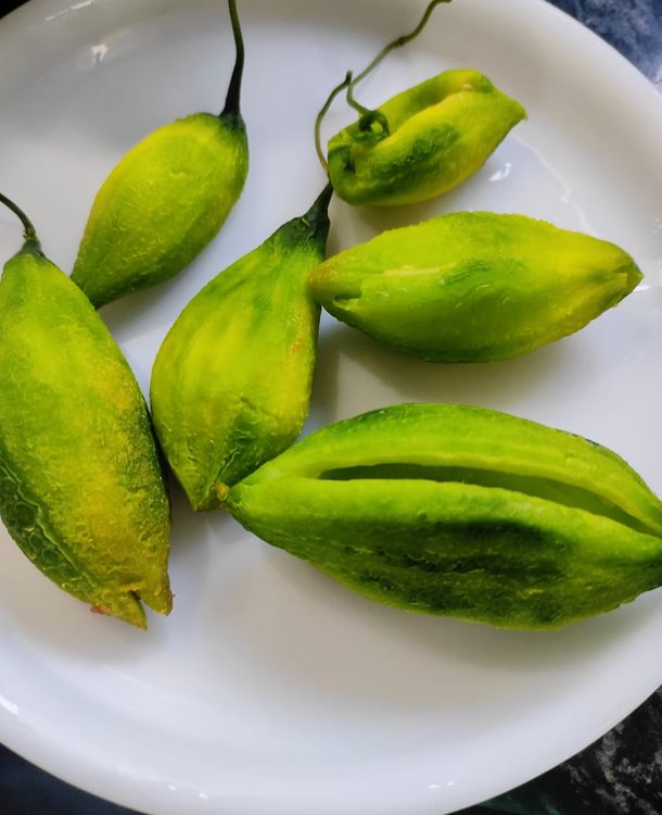 Step 1.1: Wash and peel karela and make a slit in the center, take out the big seeds if any 