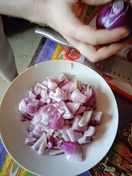 Step 2.1: Heat coconut oil in a pan and sauté the sliced onions on medium heat until golden brown