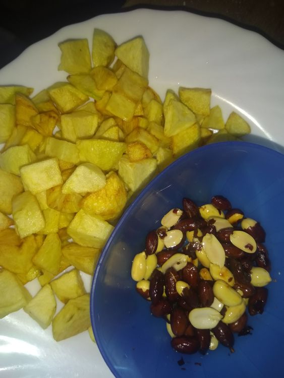Step 1.1: In the same oil, add the raw peanuts and fry until nicely browned and keep aside