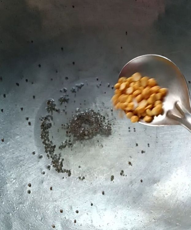 Step 1.2: Add urad dal and toor dal, and sauté until golden brown