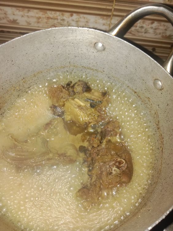 Step 1.1: Add the bush meat and stir to coat with the spice mixture