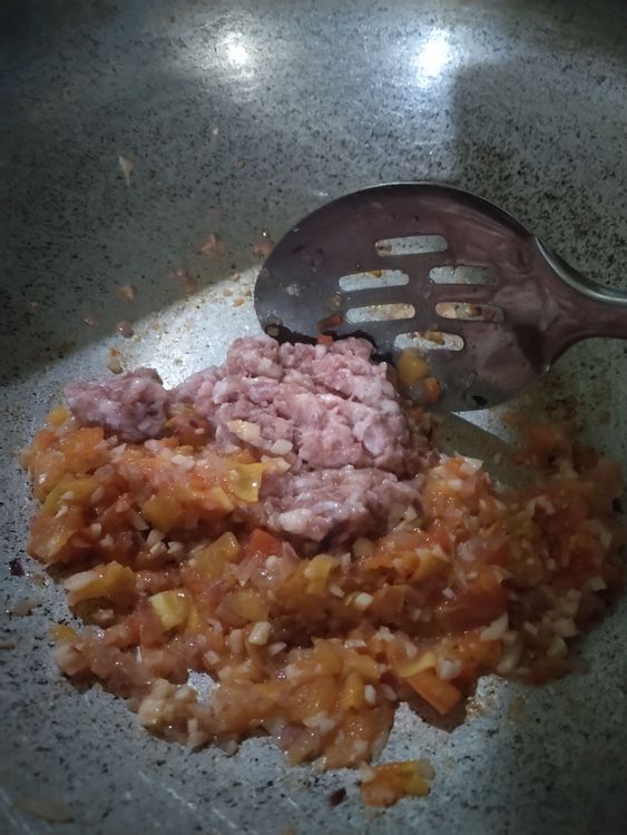 Step 1.1: Add in the ground pork and a dash of seasoning granules