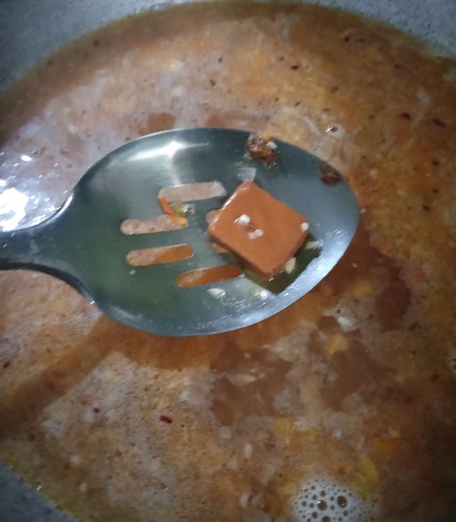 Step 1.1: Add the pork broth cube and ground pepper and fish sauce to taste