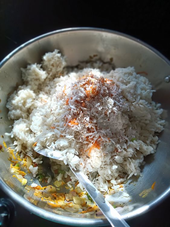Step 1.1: Add the soaked flattened rice, grated coconut, salt, and sugar