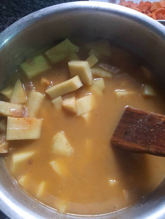 Step 1.1: In a pot, combine diced sweet potatoes, yams, water, salt, curry, pepper soup spices, diced fresh ginger, grounded red pepper, crayfish, 2 diced onions, and shawarma spice