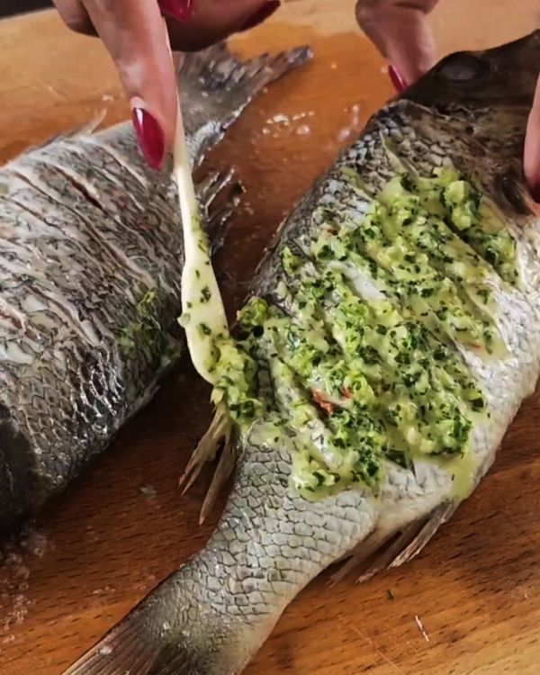 Step 2.1: Rub the marinade generously into the slits and all over the fish