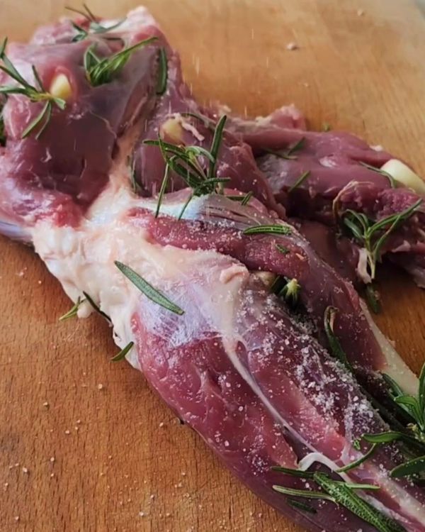 Step 2.1: Stuff the slits with rosemary and garlic