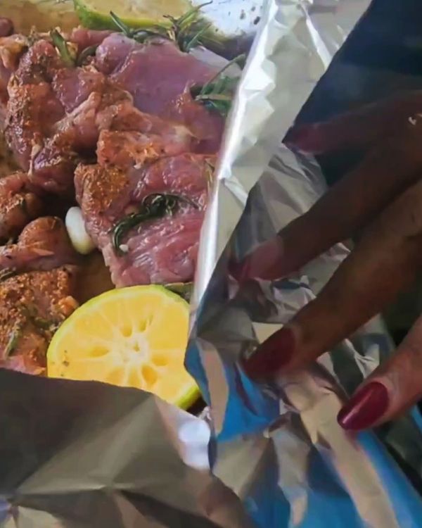 Step 3.1: Fold the foil over the leg, sealing it tightly to retain moisture