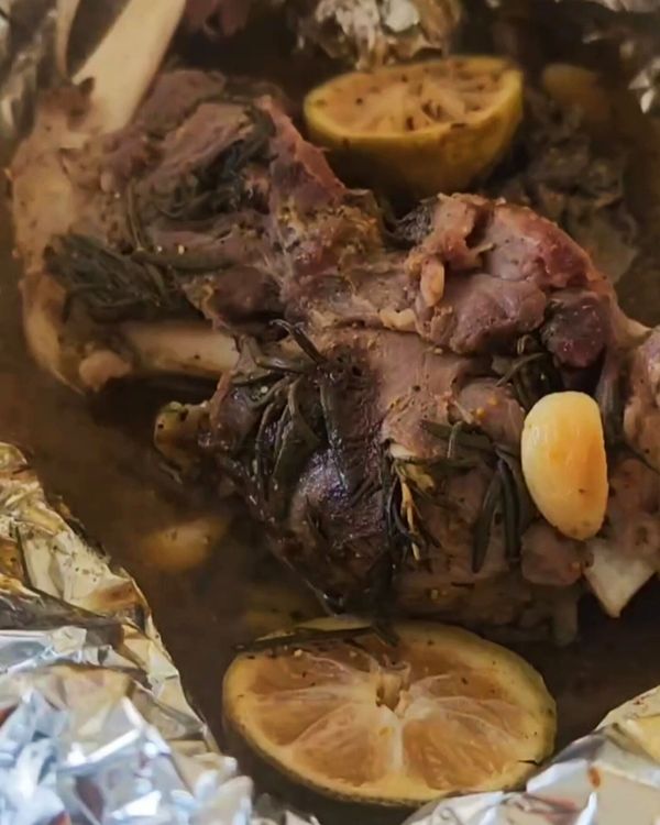 Step 4.1: After the initial 2 hours of roasting, carefully remove the foil wrapping from the goat leg