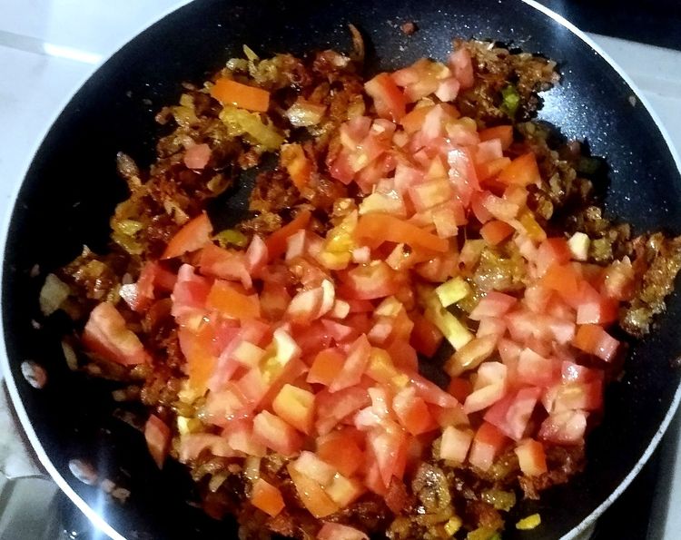 Step 1.1: Add chopped tomatoes and sauté for 2-3 minutes