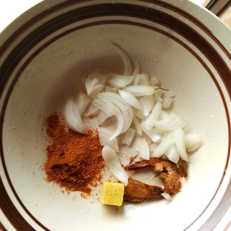 Step 1.1: Allow the oil to cook for about 15 minutes before adding in your seasoning cube, prawns, and dried pepper
