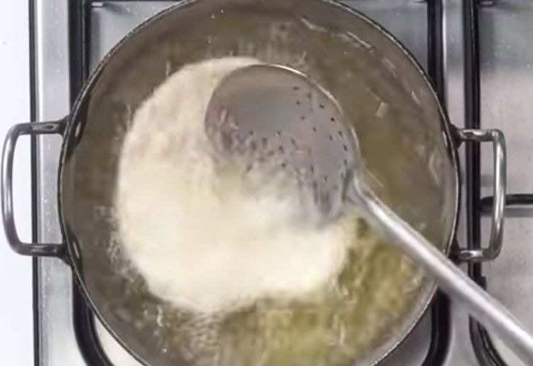 Step 1.1: Press lightly with a slotted spoon to help it puff up