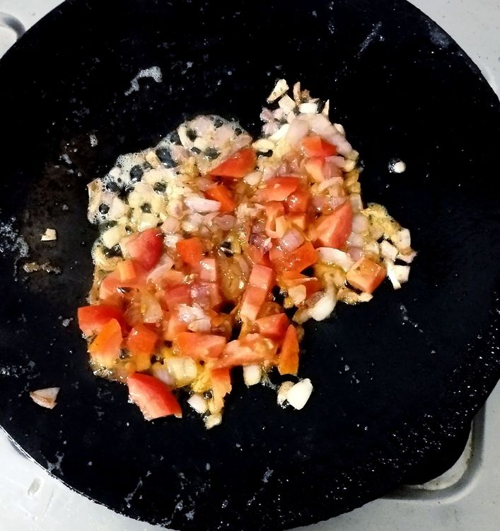 Step 1.1: Add chopped tomato and sauté until it becomes slightly tender