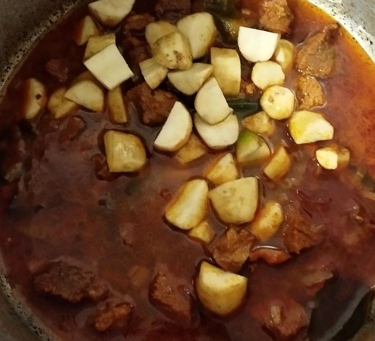 Step 3.1: Open the pressure cooker lid and add the cleaned koorkka to the beef mixture