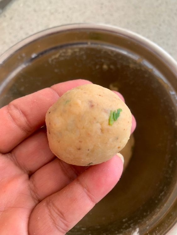 Step 1.1: Take small portions of the dough and roll them into round balls