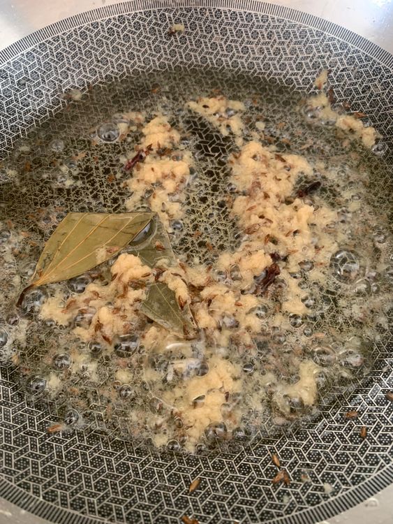 Step 2.1: Add the ginger-garlic paste and sauté for 2-3 minutes until the raw smell disappears and the paste turns slightly golden