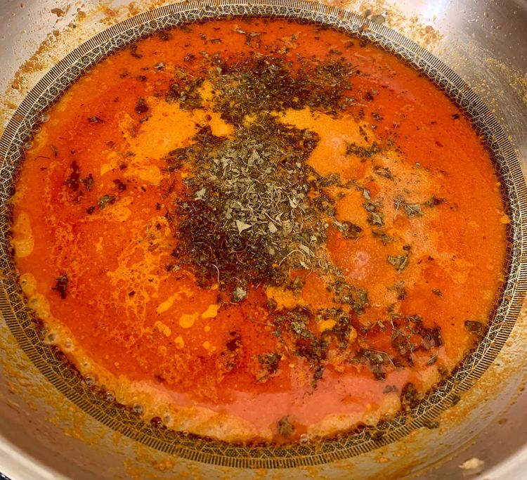Step 2.2: Pour in the water and bring the curry to a boil