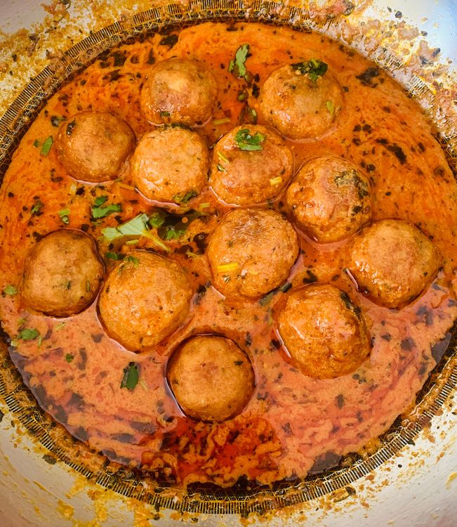 Step 2.1: Place the fried potato balls into the gravy